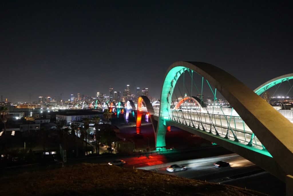 A bridge with lights on it at night.