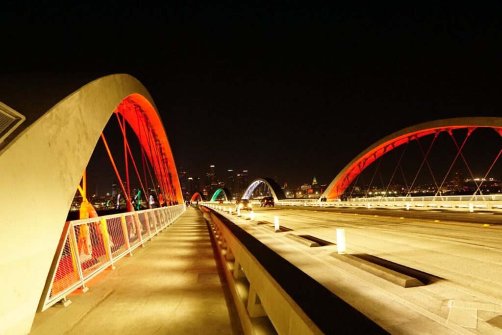 A bridge with lights on it at night.